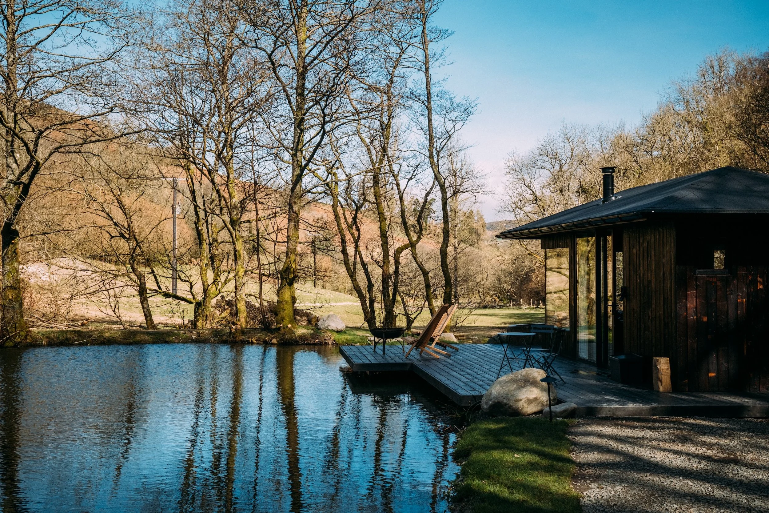 The lodge beside the lake and surrounding woodland