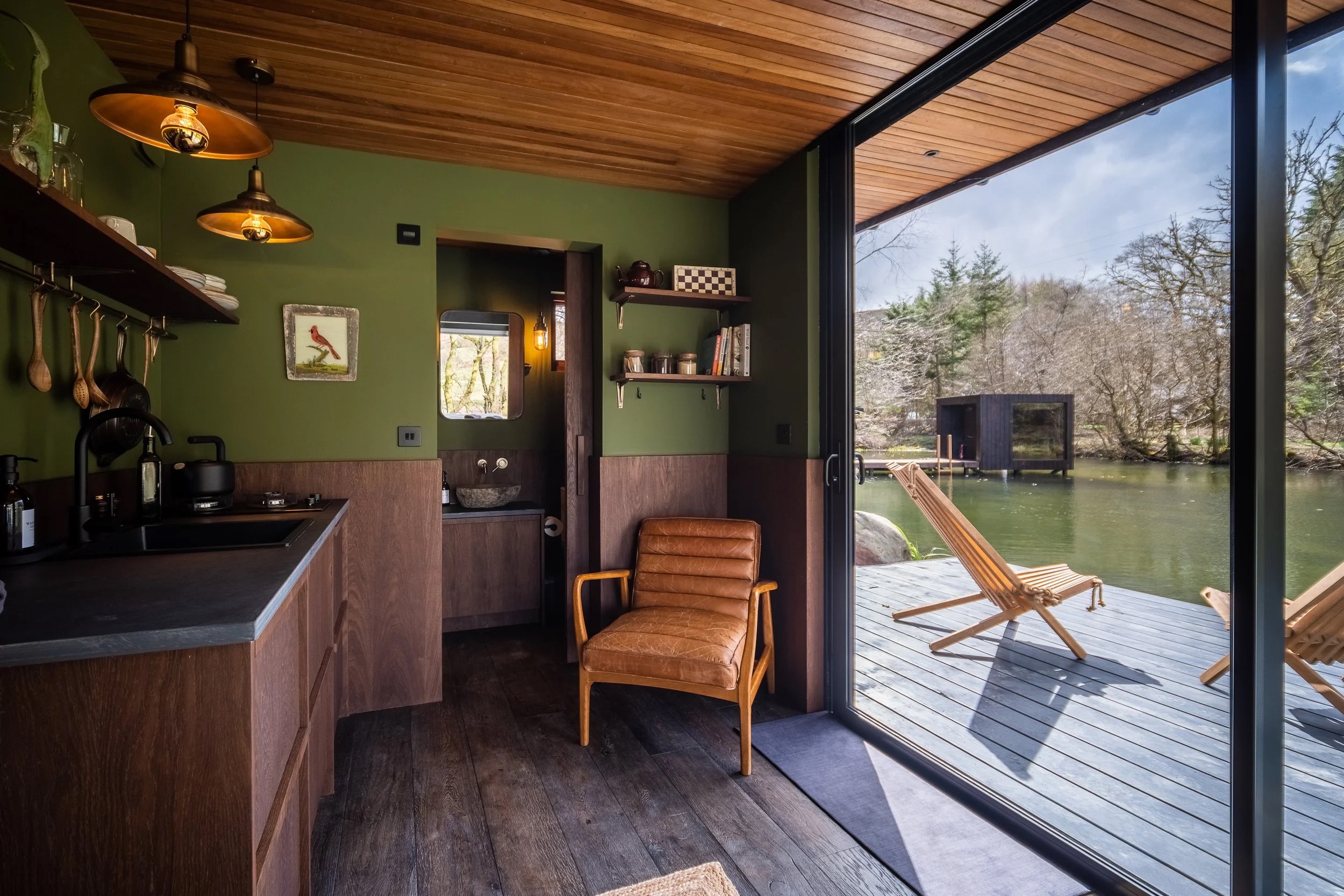 Lodge interior opening directly onto the private lakeside deck